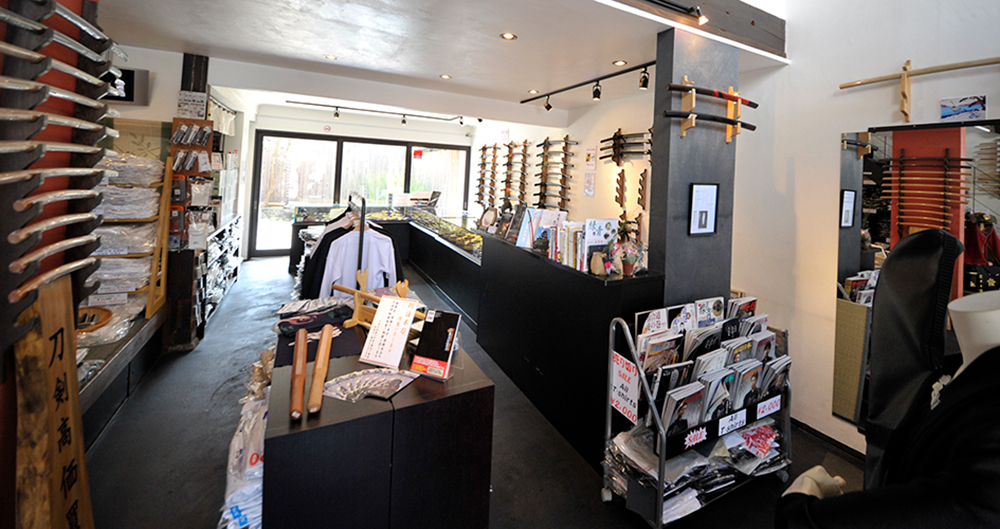 Tozando Shogoin Store's 1st floor with many swords and uniforms.